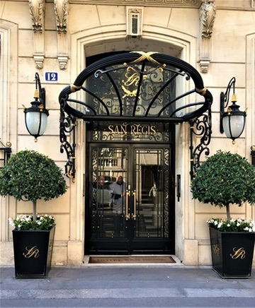 The gilded Art Nouveau entrance of the San Regis hotel in Paris, an emblem of durable, long-held luxury hospitality